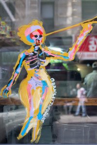 Graffiti layered over a reflection of Chinatown