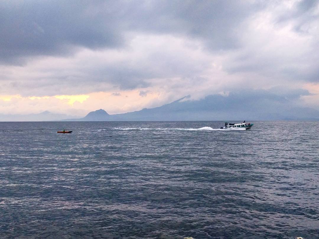 A fisherman and a lancha on Lake Atitlan